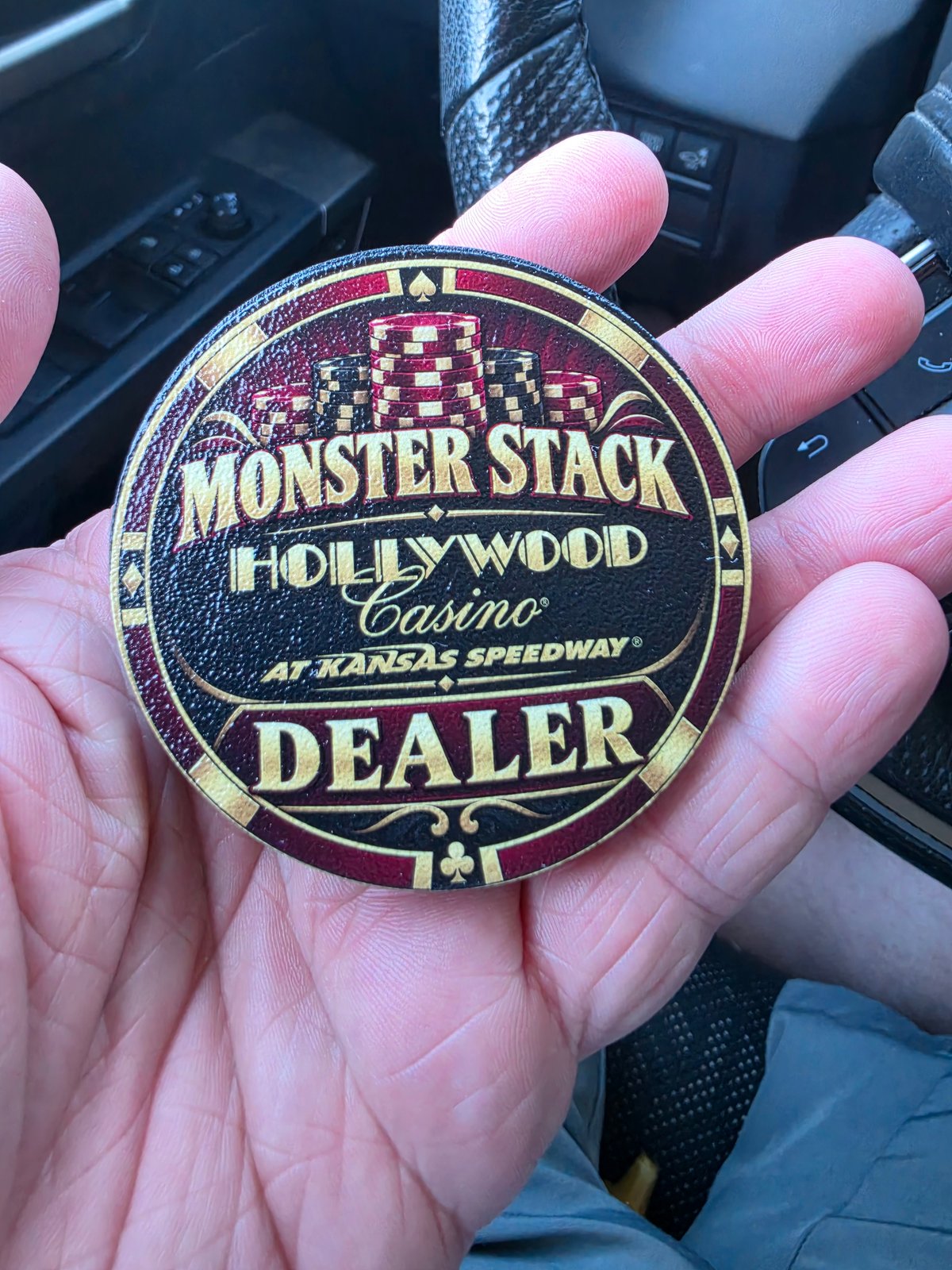 Customer photo of a Monster Stack dealer button held in a hand
